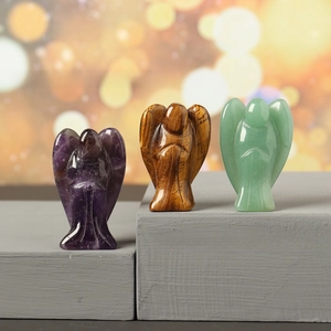 Detailed trio of polished crystal angel figurines in amethyst, tiger eye, and aventurine