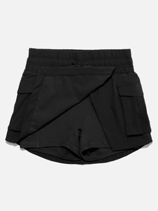 Macro detail of black cargo sports skort featuring large flap pockets and quick-dry fabric