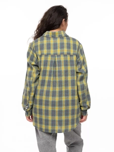 Back view of a loose-fit yellow and grey plaid shirt featuring a retro patchwork design