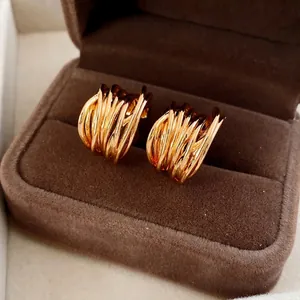 Luxury gold plated C-shaped multi-layered twisted hoop earrings for women presented in a box