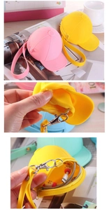 Detail showing silicone hat-shaped pouches with zippers, wrist straps and metal clasps