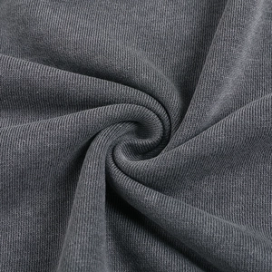 Macro shot of charcoal grey vintage washed cotton fabric texture and soft drape detail