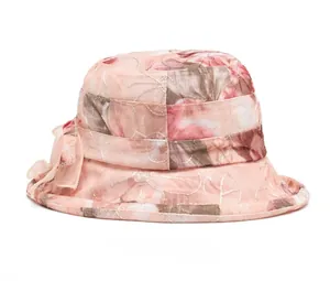 Rear view of floral bucket sun hat for women featuring a large pink organza bow detail