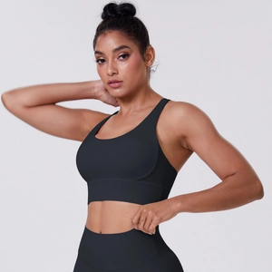 Close-up of the breathable black cross-back sports bra and high-waist leggings fabric