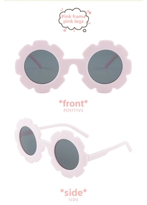 Front and side view of kids flower sunglasses with matte pink frame and dark lenses