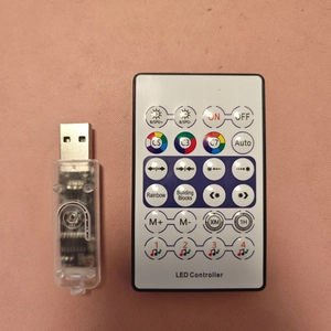 Detailed view of USB LED controller and remote for customizable RGB lighting control