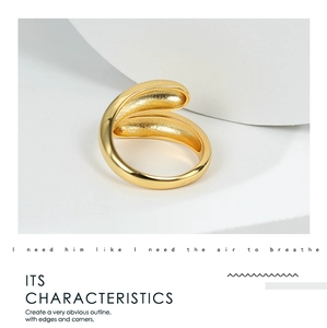 Minimalist teardrop open ring with matte finish and polished edge on white podium