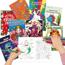 Close-up of children's Christmas coloring book showing interior pages and colored pencils