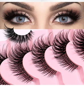 Detailed view of 7 pairs of fox-eye false eyelashes with a clear band and curled finish