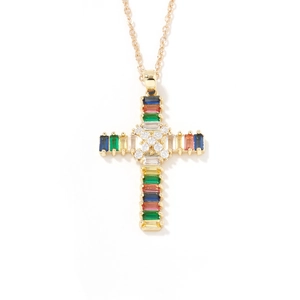 Macro shot of gold cross necklace with rainbow step-cut gems and a center white zircon