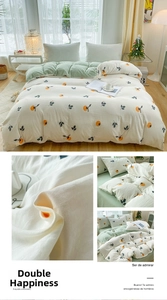 Exquisite persimmon embroidery detail on a dual-tone washed cotton duvet cover set
