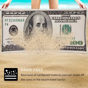 Detailed view of sandproof microfiber beach towel with 100 dollar bill print texture