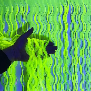 Glow-in-the-dark neon green fringe curtain detail for party and event decoration