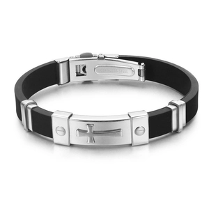 Detailed macro view of the stainless steel clasp and engraved cross on black silicone band