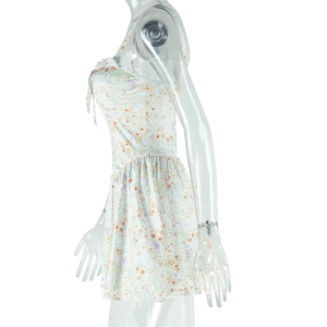 Detail of floral print dress showing chiffon fabric and ruffled bodice on a mannequin