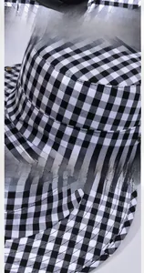 Detail of checkered sun hat featuring a 7cm wide brim and woven fabric texture