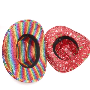 Detail view of rainbow and red Christmas cowboy hats with size tags and sweatbands