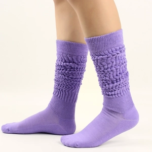 Detail of purple slouch socks showing thick knitted texture and stylish ribbed design