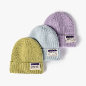 Winter thermal knit beanie hats for men and women featuring stylish boarding pass patch