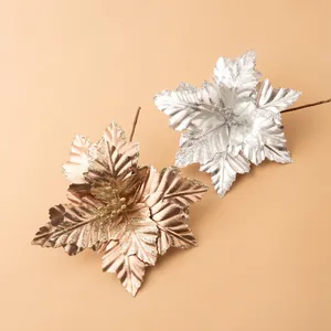 Sparkling artificial Christmas flowers in champagne gold and silver with glitter coating
