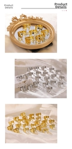 Detail of adjustable hollow letter rings in gold and silver finish on silk background