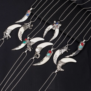 Vintage stainless steel necklaces with wolf head pendants and faux bone tooth charms