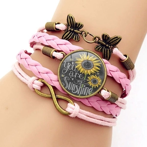 Pink multi-layer woven leather sunflower bracelet with You Are My Sunshine quote and charms