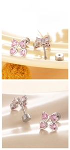 Close-up of pink zircon bow and heart stud earrings with flat back screw design