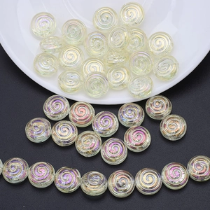 Macro detail of spiral round glass beads with aurora coating for DIY jewelry making