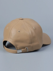 Detail of light brown PU leather baseball cap featuring adjustable metal buckle and stitching