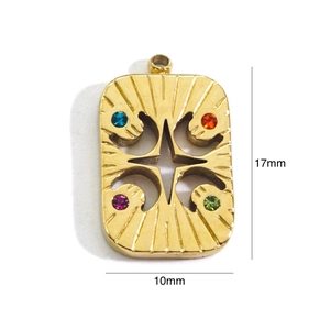 Detailed macro view of a 17mm gold star pendant with colorful inset gemstones