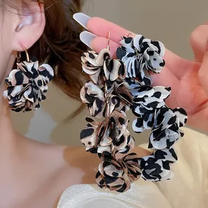 Exaggerated leopard and cow print fabric flower tassel earrings with golden ear hooks