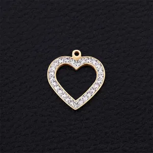 Hollow heart pendant in gold finish with sparkling rhinestones on black leather