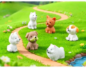 Macro detail of six miniature resin puppy figurines for DIY garden decoration