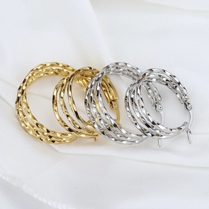 Three-layer twisted hoop earrings in gold and silver stainless steel finish