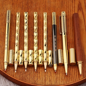Handcrafted vintage brass and wood pens with bamboo and traditional Chinese engravings