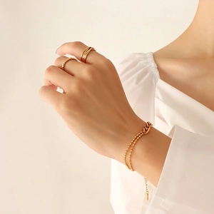 Layered 18k gold plated beaded bracelet and stacked rings set for an elegant look