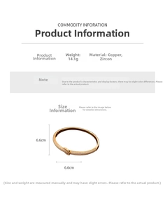 Detail view of 18K gold plated bangle showing 6.6cm inner diameter and 14.1g weight