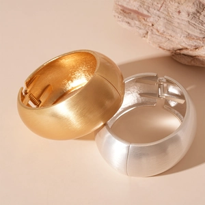 Exaggerated matte gold and silver wide geometric metal bracelets with brushed texture