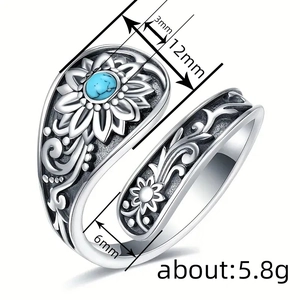 Vintage floral silver open ring featuring a round turquoise stone and detailed engravings