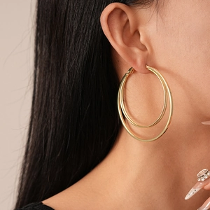 Minimalist double layered gold hoop earrings with polished geometric metal circles