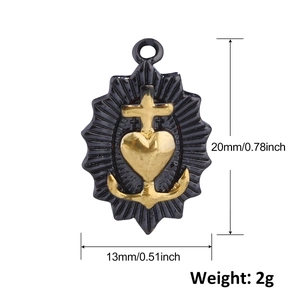 Macro detail of heart and cross gold pendant with measurements 20mm by 13mm and 2g weight