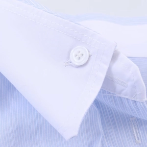 Macro shot of striped shirt collar with white contrast fabric and a resin button