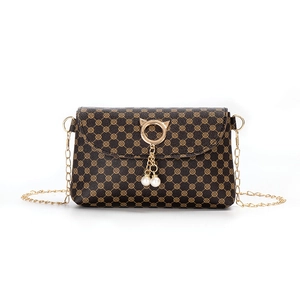 Brown mini crossbody bag with gold chain strap, cat ear ring and pearl charms