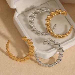 Polished gold and silver stainless steel heart-shaped C-style hoop earrings for women