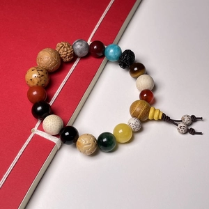 Colorful Eighteen Bodhi Seeds bracelet with natural agate and wood beads on dual background