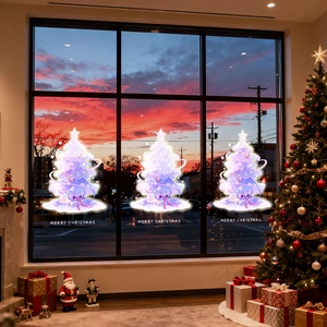 Three purple glowing Christmas tree window stickers with Merry Christmas greeting text