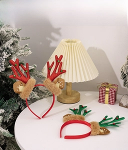 Close-up of glittery reindeer antlers headbands with plush fur and festive holiday beads