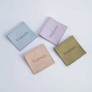 Flat lay of soft microfiber jewelry pouches in light blue, lilac, pink and green