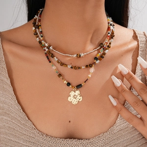 Bohemian multi-layer tiger eye beaded necklace with a golden hollow flower pendant